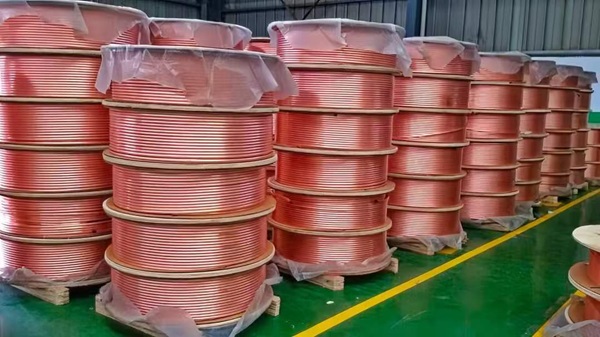 Coiled ASTM B88 copper tubes.